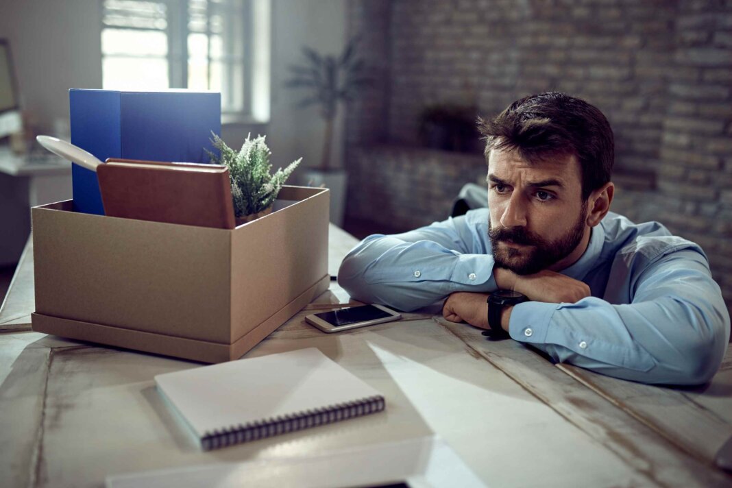 young-businessman-feeling-worried-about-losing-his-job-thinking-something-office (1)